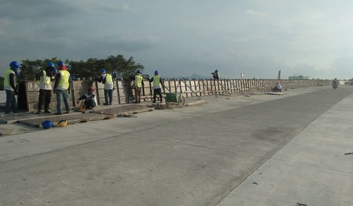 Concrete median barrier works along a roadway